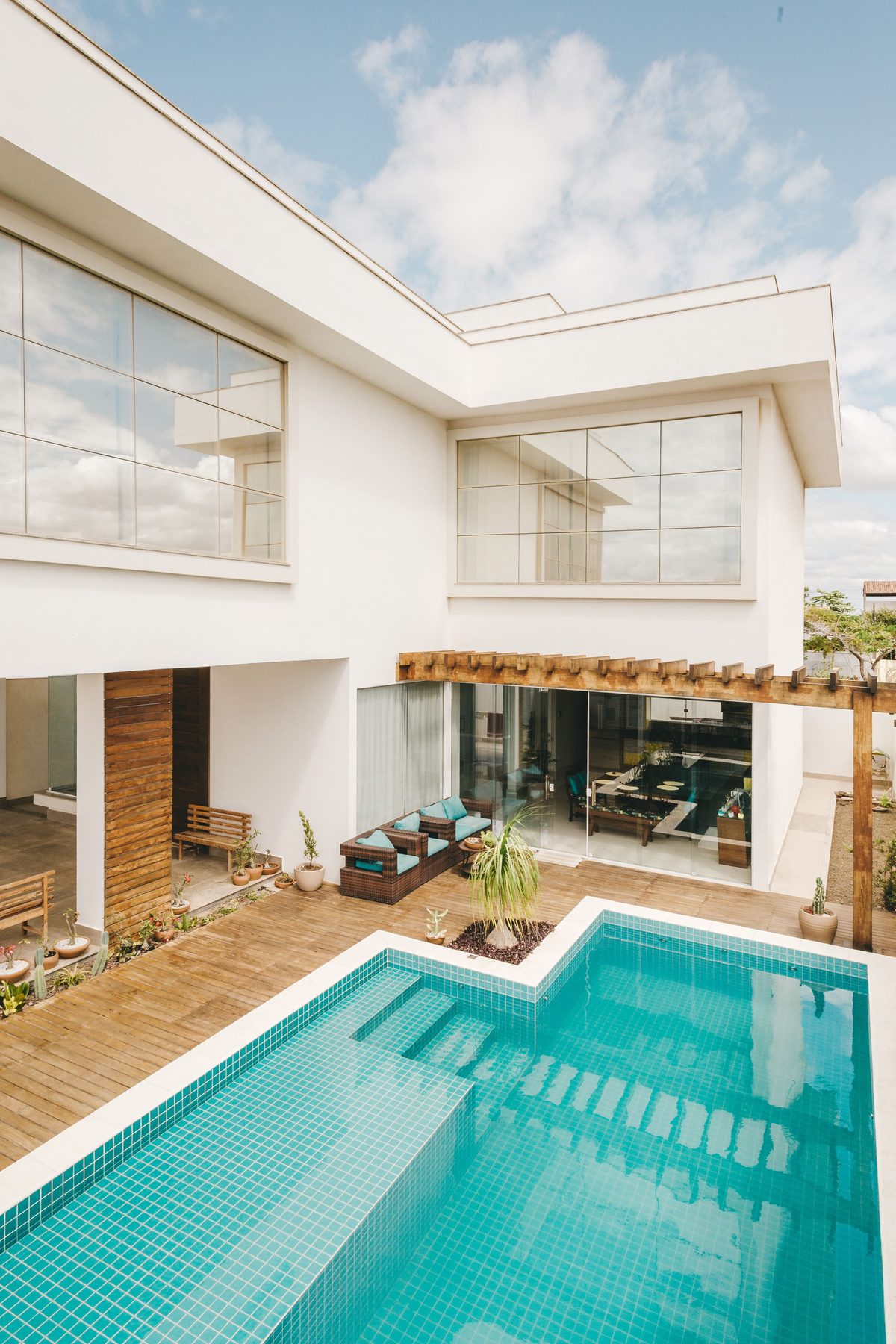 Tiled swimming pool beside a villa terrace