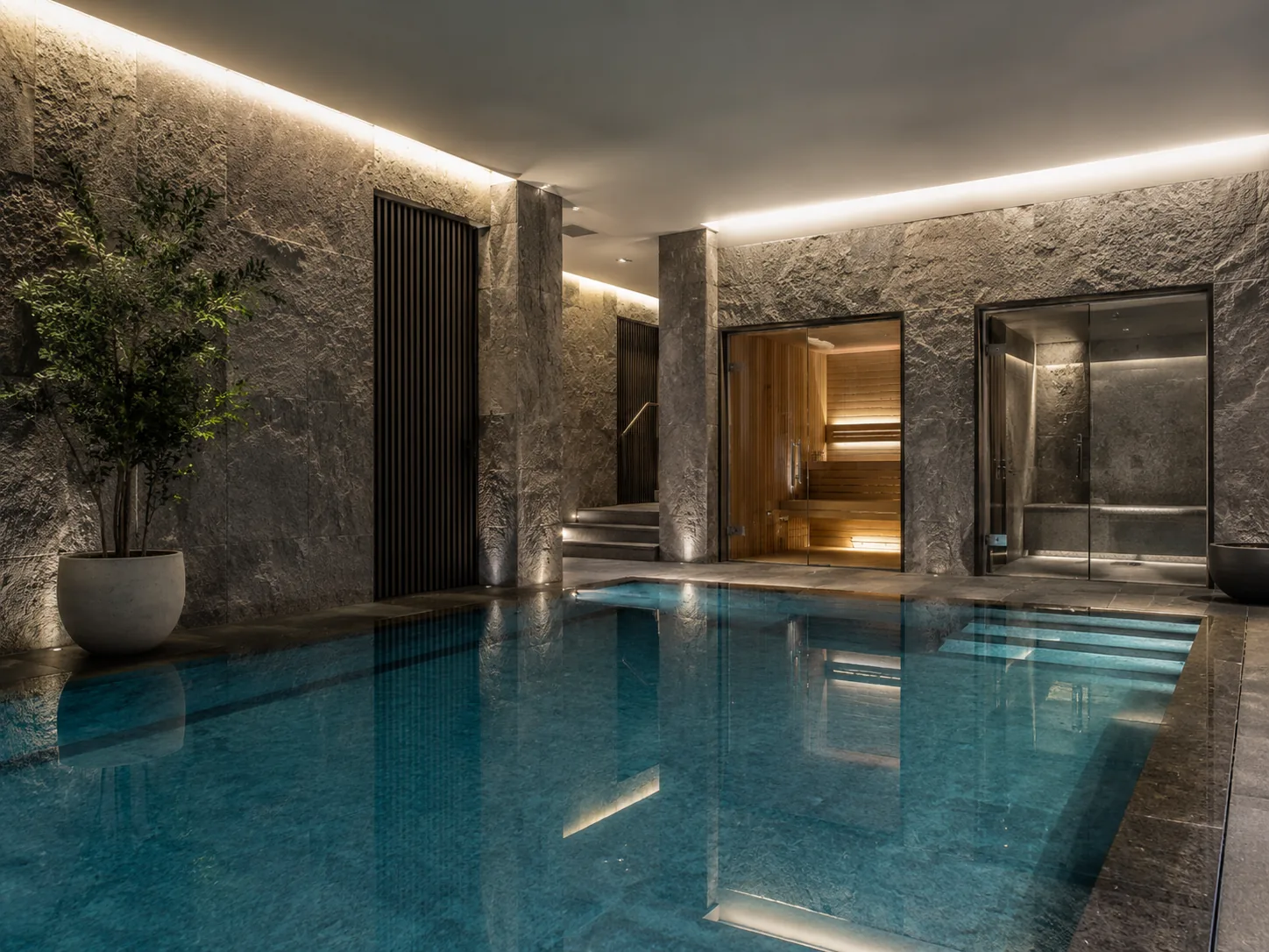Indoor pool beside sauna and steam room facilities