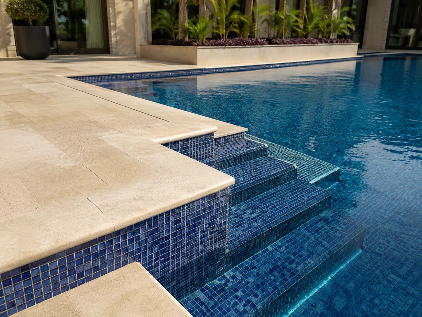 Blue mosaic tiling inside a swimming pool